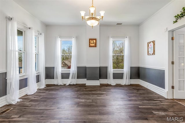 712 Maple St, Hillsboro, MO 63050 - unfurnished dining area with wood finished floors, a chandelier, and crown molding