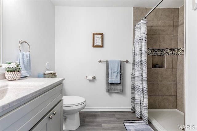 712 Maple St, Hillsboro, MO 63050 - bathroom featuring vanity, tiled shower, and wood finished floors