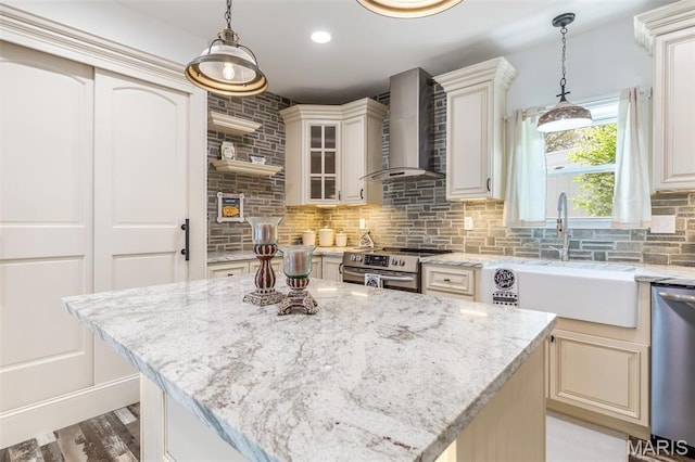 712 Maple St, Hillsboro, MO 63050 - kitchen with appliances with stainless steel finishes, wall chimney range hood, decorative backsplash, light stone countertops, and recessed lighting