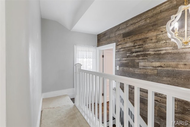 712 Maple St, Hillsboro, MO 63050 - corridor with wooden walls, an upstairs landing, and carpet flooring