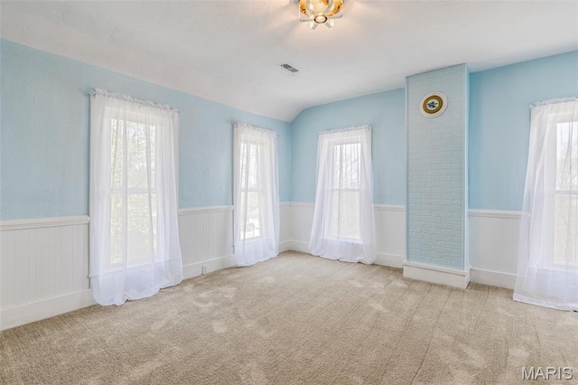 712 Maple St, Hillsboro, MO 63050 - carpeted empty room featuring a wainscoted wall and lofted ceiling