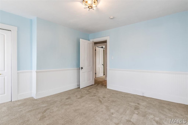 712 Maple St, Hillsboro, MO 63050 - carpeted empty room with a wainscoted wall