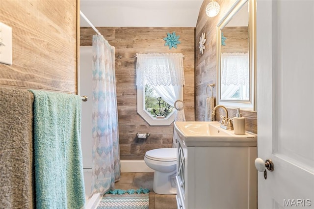 712 Maple St, Hillsboro, MO 63050 - full bathroom with vanity, wood walls, tile patterned floors, and a shower with curtain