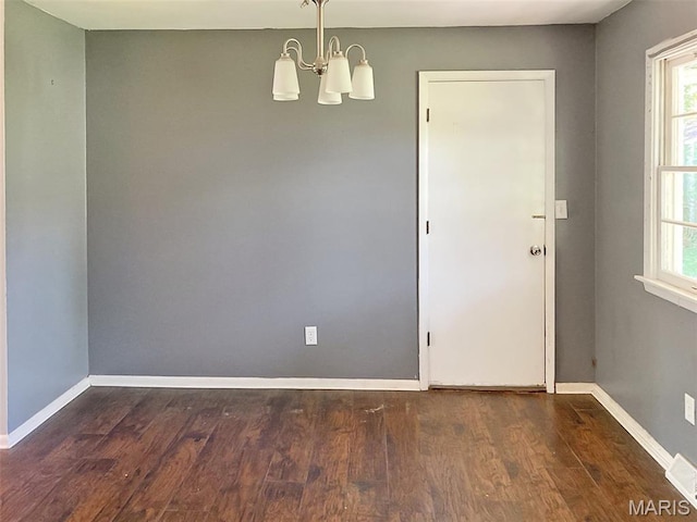 112 W Thurman St, Columbia, MO 65202 - empty room featuring a chandelier and wood finished floors