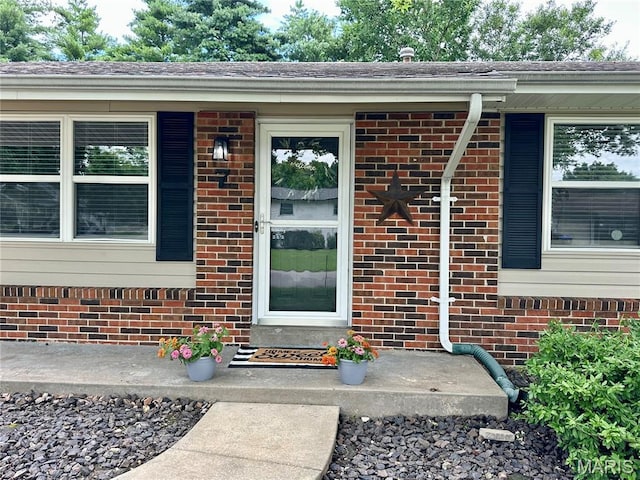 7 Oxbow Rd, Saint Peters, MO 63376 - view of exterior entry featuring brick siding and a porch