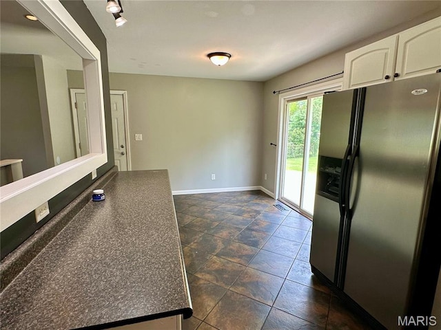 7 Oxbow Rd, Saint Peters, MO 63376 - kitchen featuring stainless steel fridge, dark countertops, and white cabinets