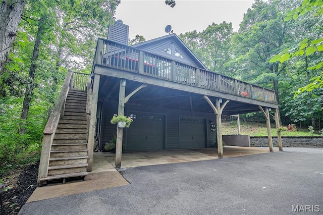 532 Fairfield Valley Rd, Pacific, MO 63069 - back of property featuring stairs, a deck, a garage, a chimney, and driveway