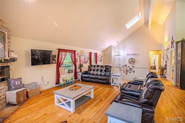 532 Fairfield Valley Rd, Pacific, MO 63069 - living area with a skylight, high vaulted ceiling, light wood-type flooring, and a chandelier