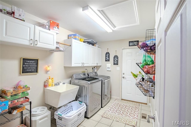 532 Fairfield Valley Rd, Pacific, MO 63069 - washroom featuring washer and clothes dryer, cabinet space, light tile patterned floors, and attic access