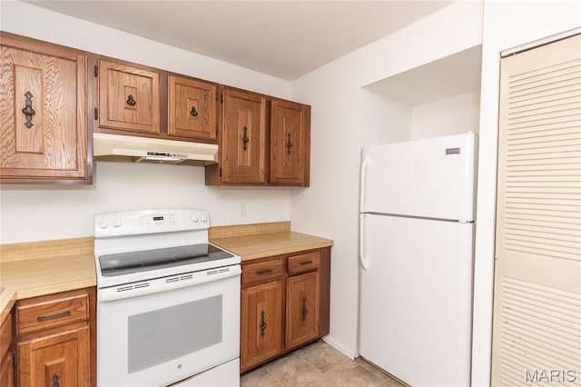 1675 Blue Ridge Dr Unit B, Lemay Township, MO 63125 - kitchen with white appliances, under cabinet range hood, brown cabinetry, and light countertops