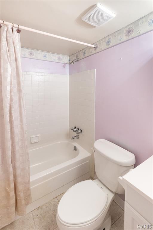 1675 Blue Ridge Dr Unit B, Lemay Township, MO 63125 - bathroom featuring shower / bathtub combination with curtain, vanity, and tile patterned flooring