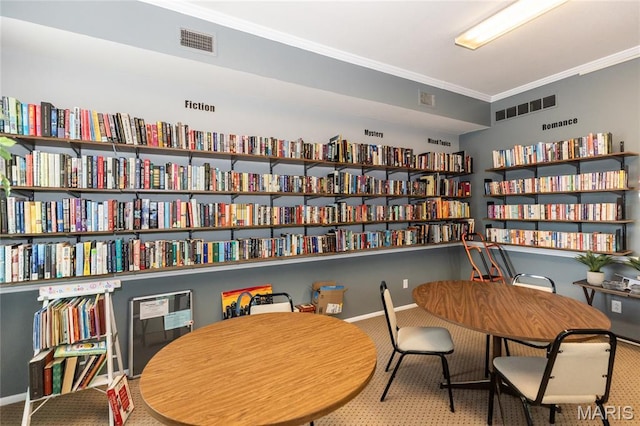 1675 Blue Ridge Dr Unit B, Lemay Township, MO 63125 - sitting room with wall of books, carpet, and crown molding