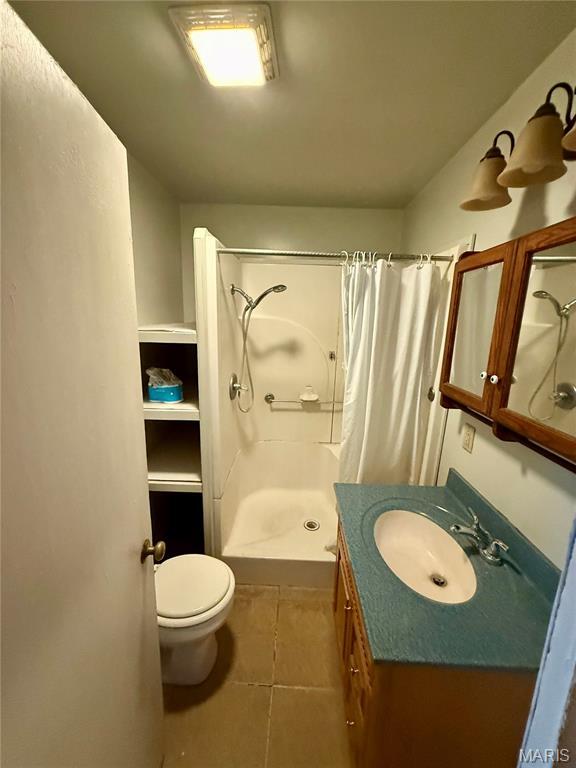 504 Wolfe St, Potosi, MO 63664 - full bath featuring a stall shower, vanity, and tile patterned flooring