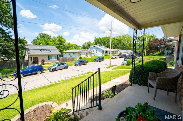 346 Madison Ave, Saint Louis, MO 63119 - covered porch with a residential view and a lawn
