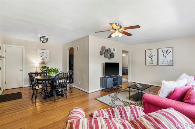 346 Madison Ave, Saint Louis, MO 63119 - living room with ceiling fan, arched walkways, and wood finished floors