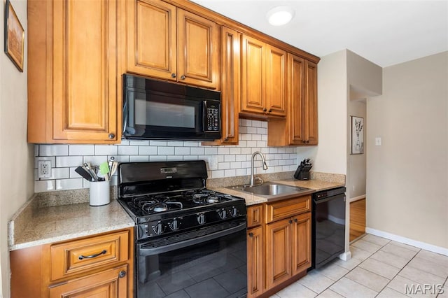 346 Madison Ave, Saint Louis, MO 63119 - kitchen with black appliances, decorative backsplash, light tile patterned floors, and brown cabinets