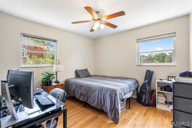 346 Madison Ave, Saint Louis, MO 63119 - bedroom featuring light wood finished floors, a desk, and a ceiling fan