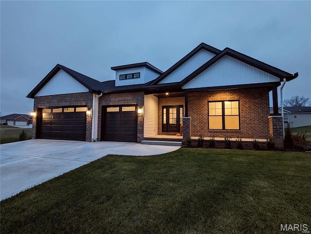 8748 Wendell Creek Dr, Saint Jacob, IL 62281 - view of front facade with brick siding, driveway, an attached garage, and a front yard