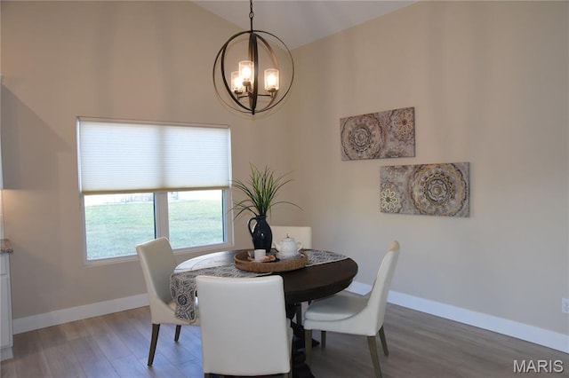 8748 Wendell Creek Dr, Saint Jacob, IL 62281 - dining area featuring a chandelier, light wood finished floors, and lofted ceiling