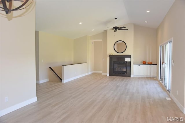 8748 Wendell Creek Dr, Saint Jacob, IL 62281 - unfurnished living room with a ceiling fan, light wood-style flooring, a glass covered fireplace, recessed lighting, and high vaulted ceiling