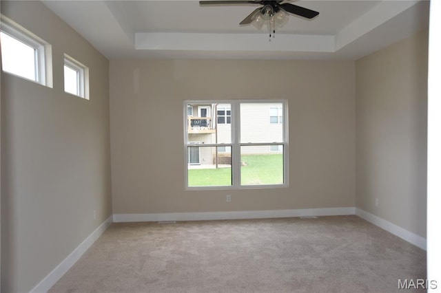 8748 Wendell Creek Dr, Saint Jacob, IL 62281 - empty room with a raised ceiling, light colored carpet, and ceiling fan