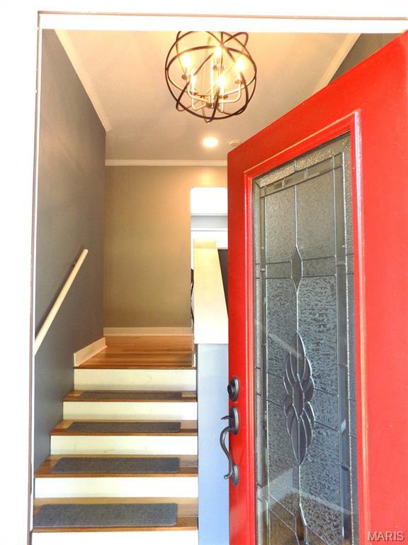 14875 County Road 2310, St James, MO 65559 - stairway featuring a chandelier and ornamental molding