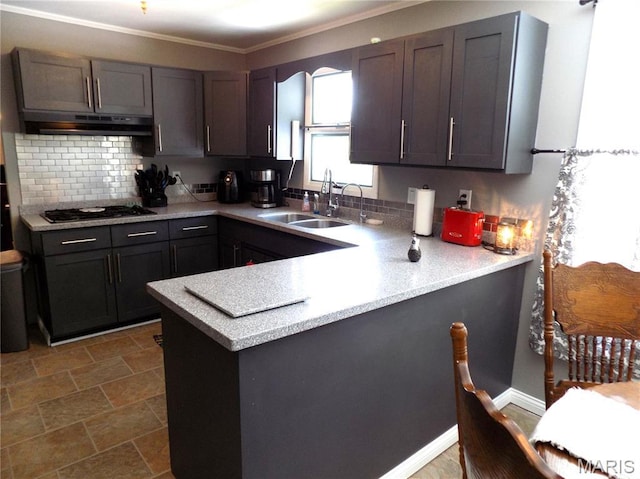 14875 County Road 2310, St James, MO 65559 - kitchen with under cabinet range hood, stainless steel gas cooktop, a peninsula, light countertops, and ornamental molding