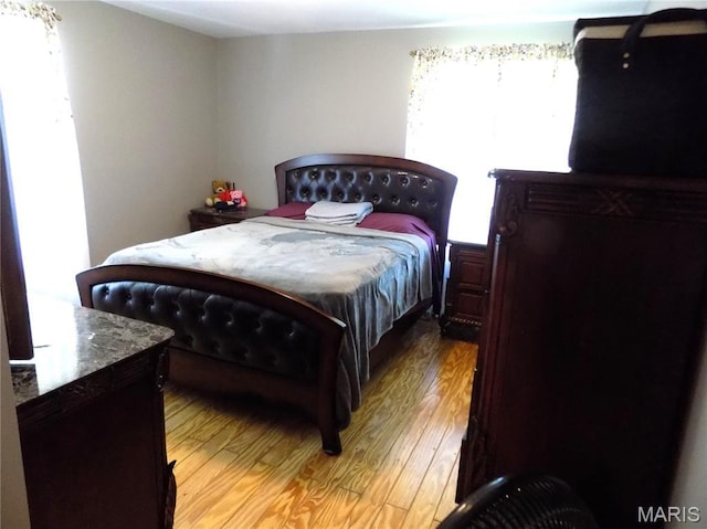 14875 County Road 2310, St James, MO 65559 - bedroom featuring light wood-style flooring