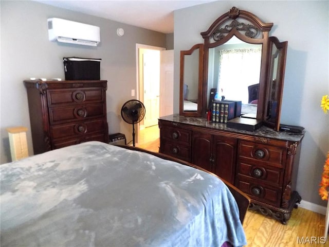 14875 County Road 2310, St James, MO 65559 - bedroom featuring a wall unit AC and light wood-type flooring
