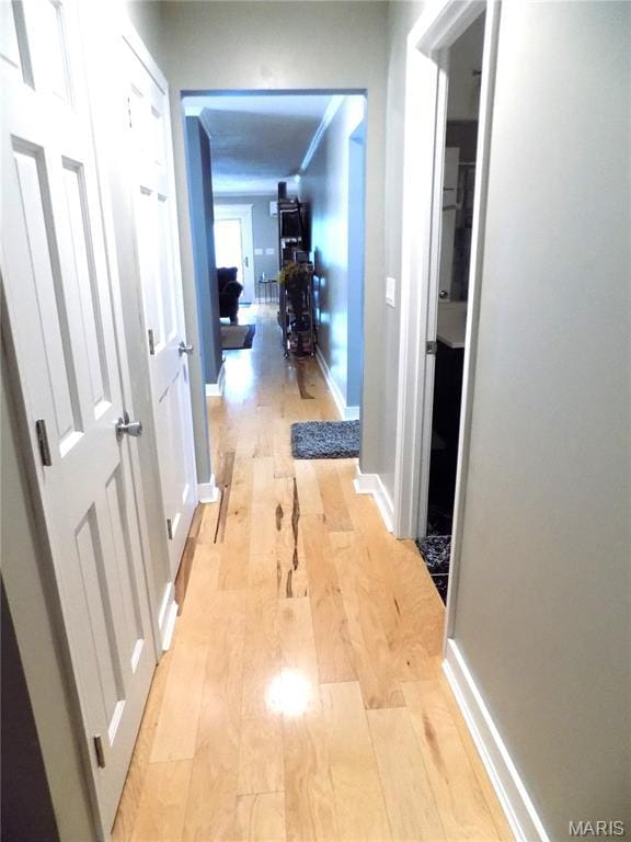 14875 County Road 2310, St James, MO 65559 - hallway featuring light wood-style flooring and baseboards