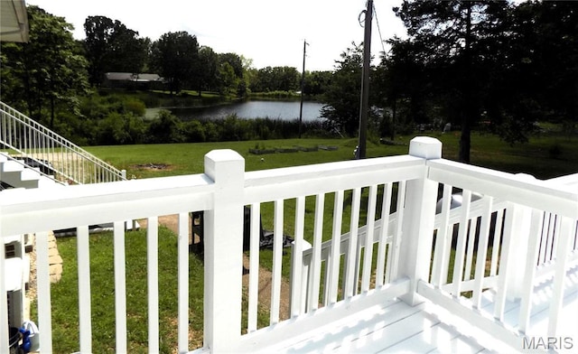 14875 County Road 2310, St James, MO 65559 - wooden terrace with a water view, a lawn, and stairs