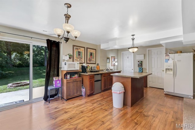 25 Saint Kathleen Ct, Troy, MO 63379 - kitchen with white appliances, light wood-style floors, light countertops, a chandelier, and brown cabinetry