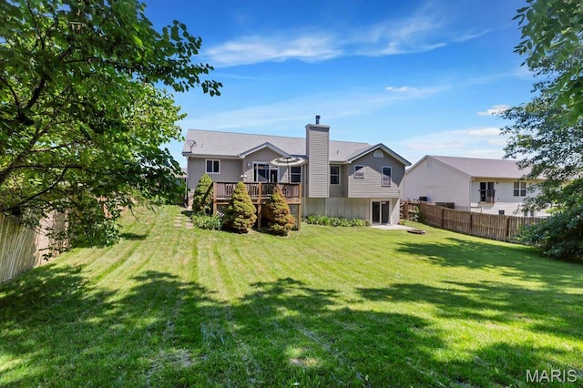 25 Saint Kathleen Ct, Troy, MO 63379 - back of property with a wooden deck and a chimney