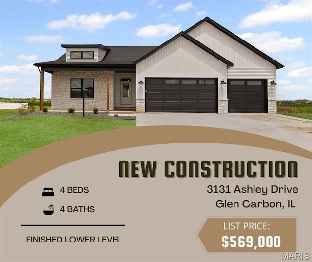 3131 Ashley Dr, Glen Carbon, IL 62034 - view of front of house with stone siding, an attached garage, driveway, and a front lawn