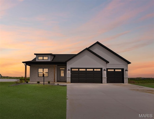 3131 Ashley Dr, Glen Carbon, IL 62034 - modern farmhouse style home featuring stone siding, a garage, driveway, and a front lawn