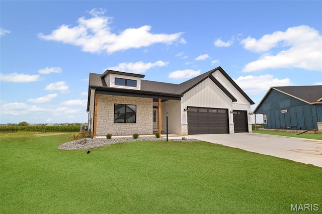 3131 Ashley Dr, Glen Carbon, IL 62034 - modern farmhouse featuring stone siding, a garage, a front lawn, and concrete driveway