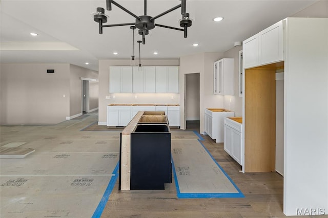 3131 Ashley Dr, Glen Carbon, IL 62034 - kitchen with a kitchen island, recessed lighting, white cabinetry, and hanging light fixtures