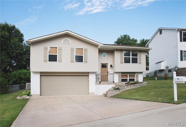 10 Marcus Dr, Saint Peters, MO 63376 - bi-level home with driveway, an attached garage, and brick siding
