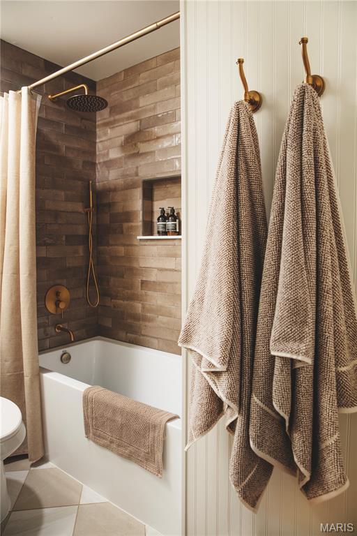 10 Marcus Dr, Saint Peters, MO 63376 - bathroom with shower / bathtub combination with curtain and tile patterned flooring