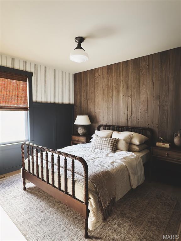 10 Marcus Dr, Saint Peters, MO 63376 - bedroom featuring wood finished floors and wood walls