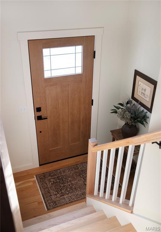 10 Marcus Dr, Saint Peters, MO 63376 - entrance foyer with light wood-style floors and stairway