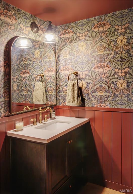 10 Marcus Dr, Saint Peters, MO 63376 - bathroom featuring wallpapered walls, a decorative wall, and vanity