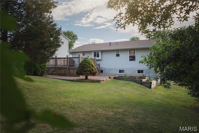 10 Marcus Dr, Saint Peters, MO 63376 - rear view of property with a deck, a lawn, and a vegetable garden