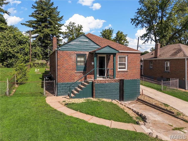 5211 Fletcher St, Jennings, MO 63136 - bungalow-style house featuring brick siding, a chimney, and a gate