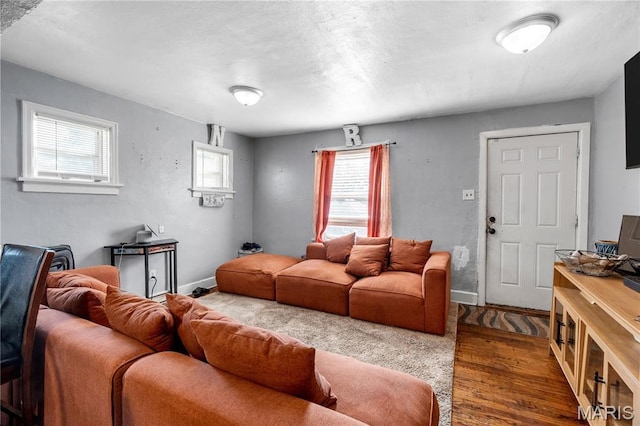 5211 Fletcher St, Jennings, MO 63136 - living area with wood finished floors and baseboards