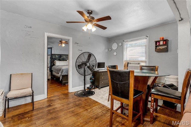5211 Fletcher St, Jennings, MO 63136 - dining area featuring a ceiling fan, wood finished floors, and cooling unit