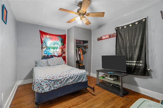 5211 Fletcher St, Jennings, MO 63136 - bedroom featuring wood finished floors, a closet, and a ceiling fan