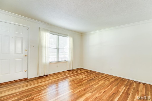 4828 Plum Tree Ln, Hazelwood, MO 63042 - empty room featuring light wood-style flooring, a textured ceiling, and crown molding