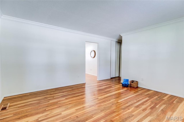 4828 Plum Tree Ln, Hazelwood, MO 63042 - unfurnished room featuring crown molding and light wood-style flooring
