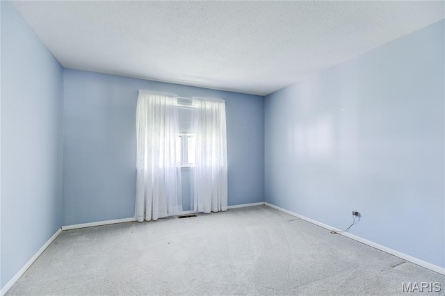 4828 Plum Tree Ln, Hazelwood, MO 63042 - unfurnished room with carpet flooring and a textured ceiling